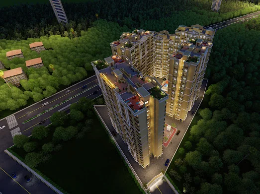 The Vishnu Vertex tower lit at night above the tree line